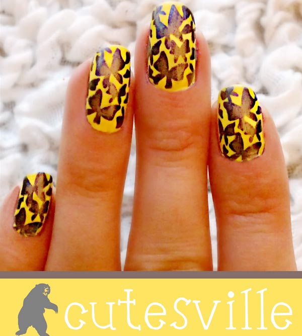 black butterflies stamped on yellow nails