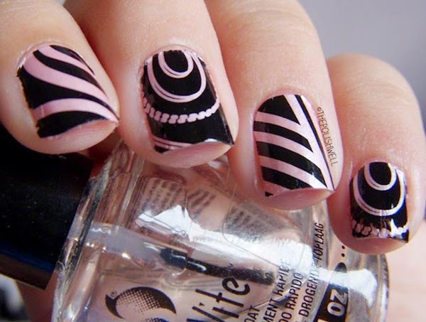 black patterns over pink nails