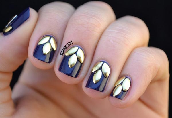golden leaves on black nails