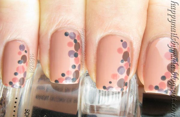 multicolored dots on beige nails
