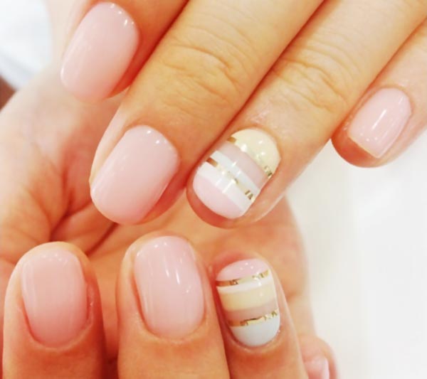 pink yellow gold striped delicate nails