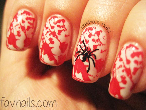 stamped red splatter spider halloween nails