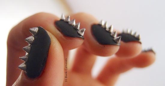 silver spikes on black nails