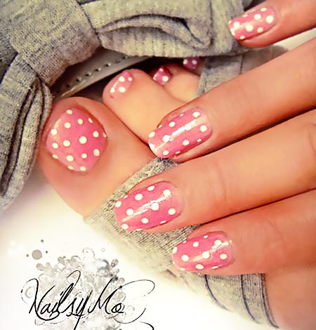 white dots on pink nails
