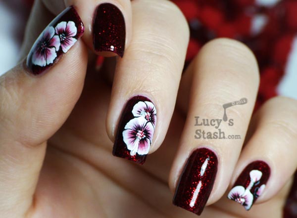 white flowers shimmer deep red nails