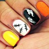 yellow white black orange halloween nails